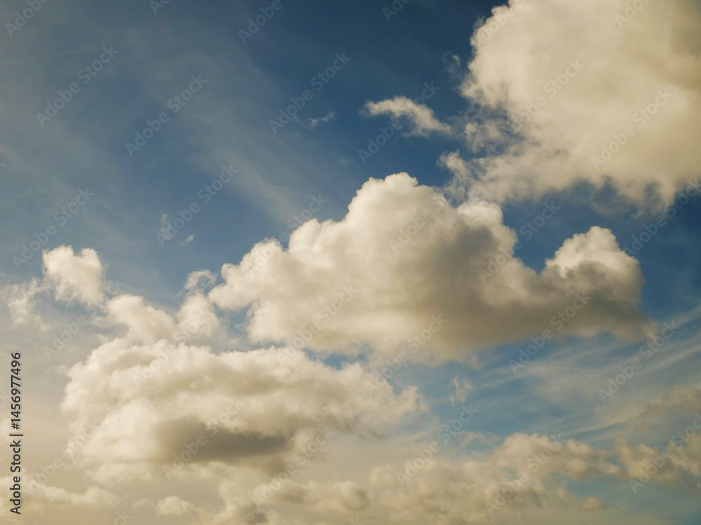 Blue cloudy sky, nature background for design. Clouds have random shape and form.