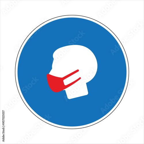 Round mandatory face mask sign advising people to wear face covering in public places