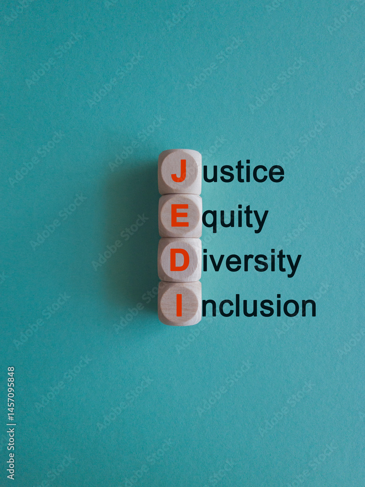 Justice equity diversity inclusion symbol. Concept words JEDI Justice Equity Diversity Inclusion on cubes. Beautiful blue background. Business justice equity diversity inclusion concept.