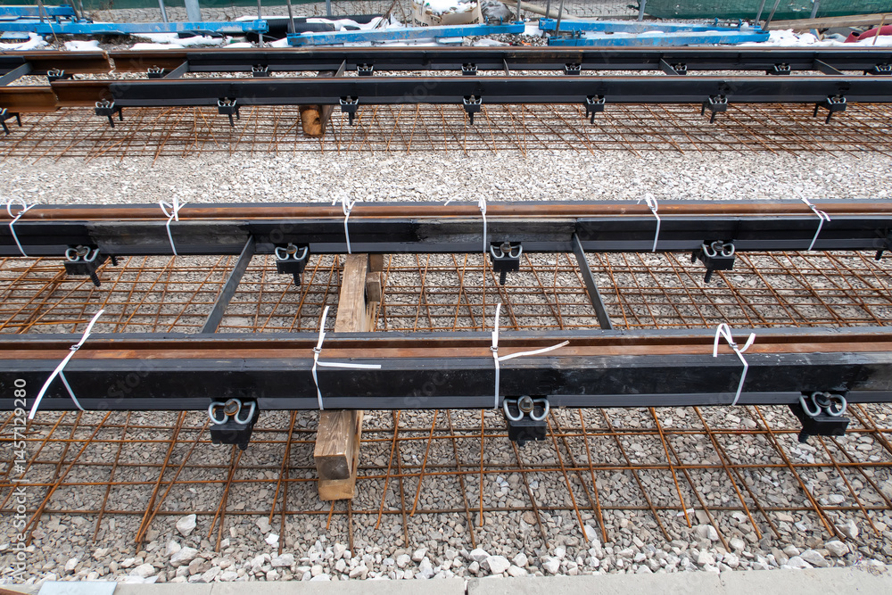 close-up of railway tracks being constructed or repaired