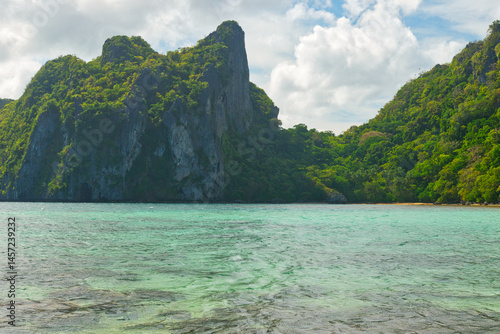 PALAWAN, PHILIPPINES - DECEMBER 21, 2023: Landscape of the beautiful mountain cliff in the sea, El Nido province in Palawan island in Philippines. 6 million tourists visited Philippines in 2016.