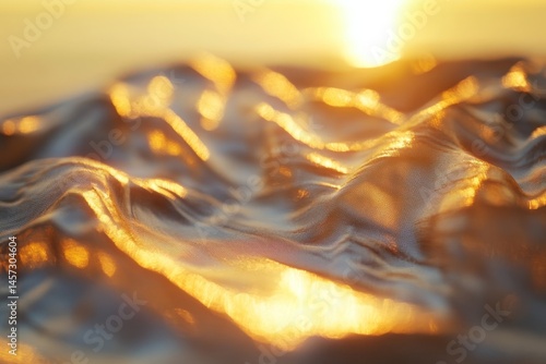 Golden light reflecting on rippling water surface.
