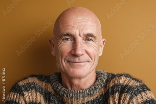 Bald man with a gentle smil...