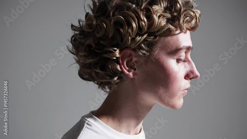 Dynamic rotation of curlyhaired individual with shadow play