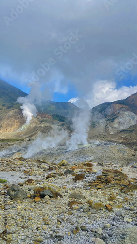 Several fumaroles in the volcanic crater area. Fumarol containing sulfur, solfatara. Papandayan mount,Indonesia. Vertical photography
