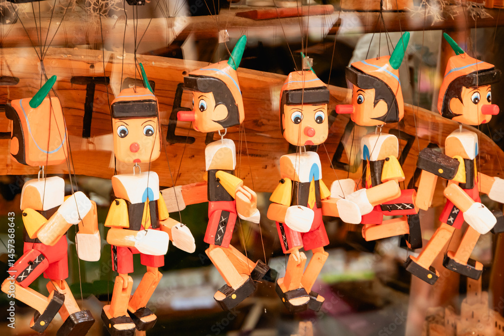 Showcase with charming wooden Pinocchio puppets for puppet theater