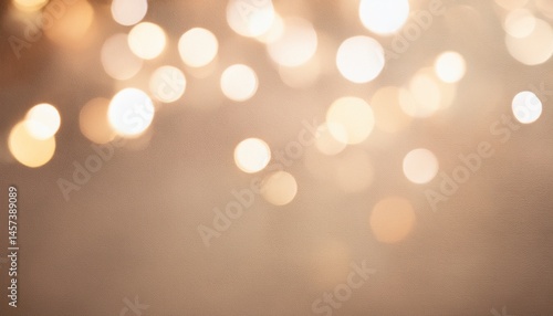 blurred bokeh lights on beige background abstract