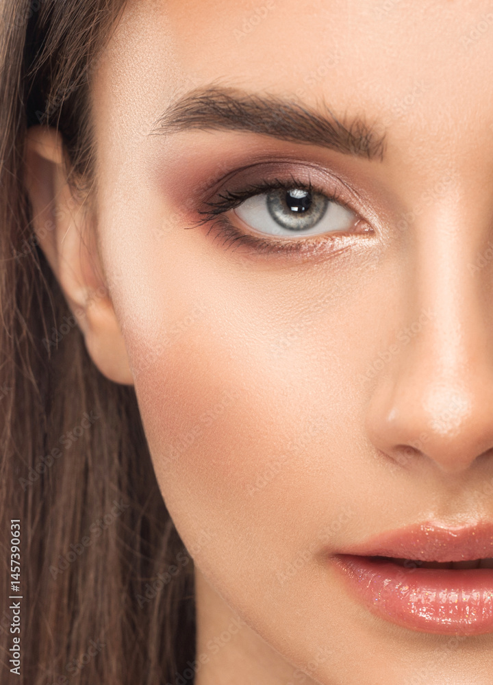 Fototapeta premium Portrait of attractive girl with healthy clean skin and beautiful make-up. Aesthetic cosmetology and makeup concept.