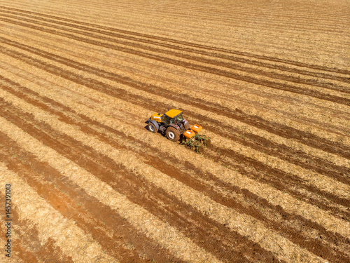 fertilizing land where sugar cane was planted aerial view