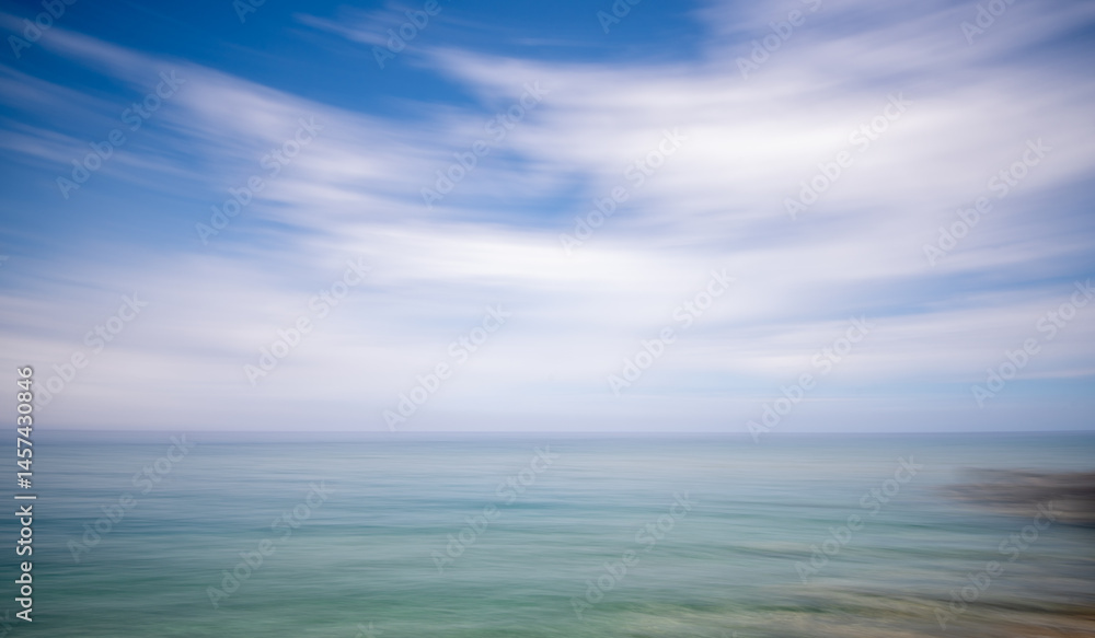 Blurred ocean horizon with dynamic sky movement