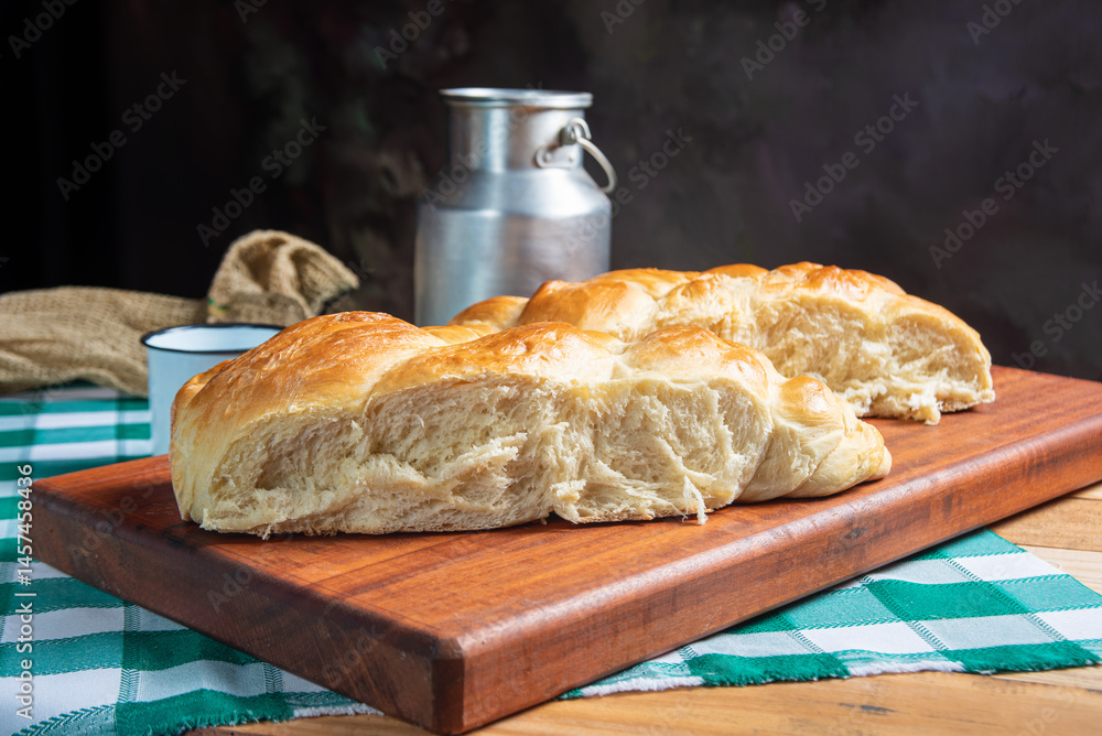 Homemade bread, a beautiful breakfast table with delicious homemade bread on a rustic wooden surface with a tablecloth, selective focus.