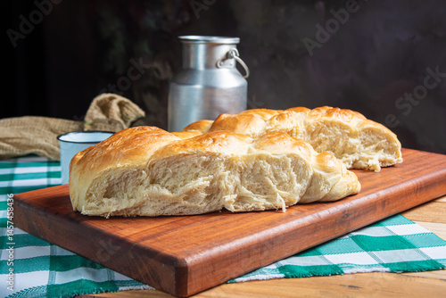 Obraz na płótnie Homemade bread, a beautiful breakfast table with delicious homemade bread on a rustic wooden surface with a tablecloth, selective focus. w salonie