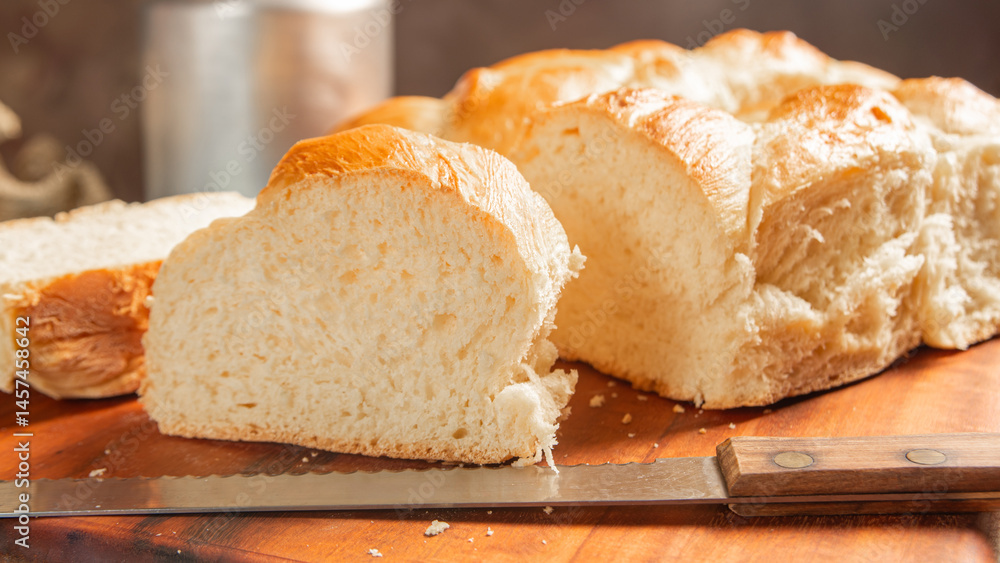Homemade bread, a beautiful breakfast table with delicious homemade bread on a rustic wooden surface with a tablecloth, selective focus. Homemade bread, a beautiful breakfast table with delicious homemade bread on a rustic wooden surface with a tablecloth, selective focus.