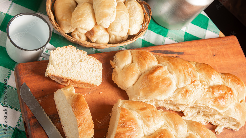 Homemade bread, a beautiful breakfast table with delicious homemade bread on a rustic wooden surface with a tablecloth, selective focus.