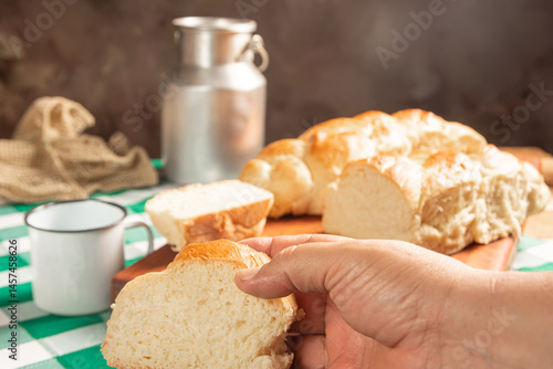 Obraz na płótnie Homemade bread, a beautiful breakfast table with delicious homemade bread on a rustic wooden surface with a tablecloth, selective focus. w salonie