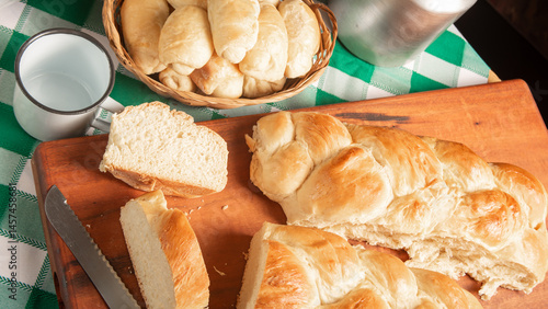 Obraz na płótnie Homemade bread, a beautiful breakfast table with delicious homemade bread on a rustic wooden surface with a tablecloth, selective focus. w salonie