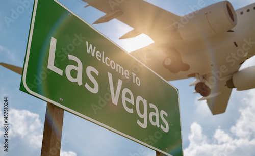 Welcome To Las Vegas Green Road Sign with Low Flying Airplane Just Above with Landing Gear Down.