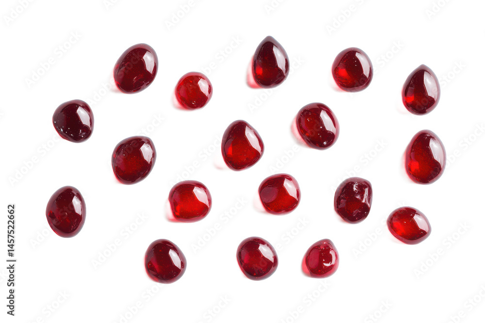 A mosaic of pomegranate seeds with a gray and black background in a grid like arrangement close up view A mosaic of pomegranate seeds with a gray and black background in a grid like arrangement close up view