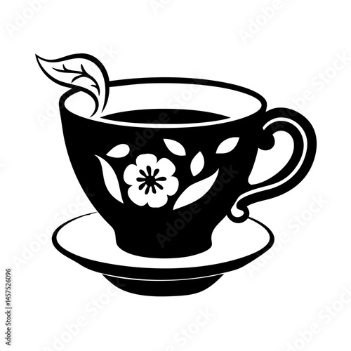 Elegant teacup with floral design and a floating leaf, black and white