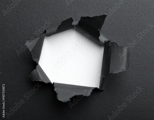 torn black paper with white underneath copy space, ripped paper background
