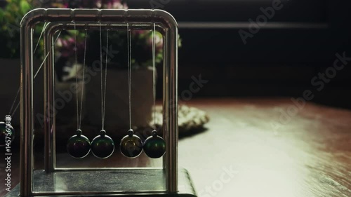 Newtons Cradle on a Wooden Table