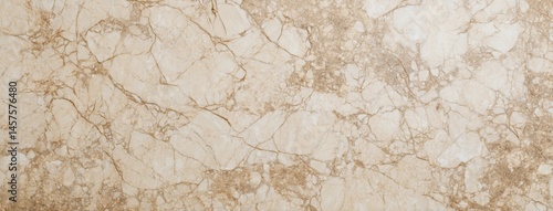 Beige marble stone texture features brown veins forming a natural, elegant pattern, suitable for backgrounds and design projects related to luxury, nature, and interior design