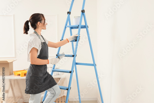 Young woman home improvemen...