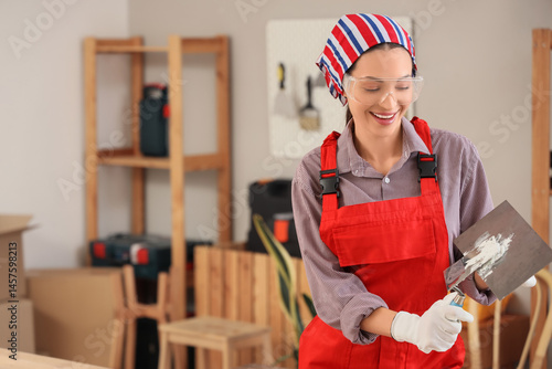 Female decorator with putty...