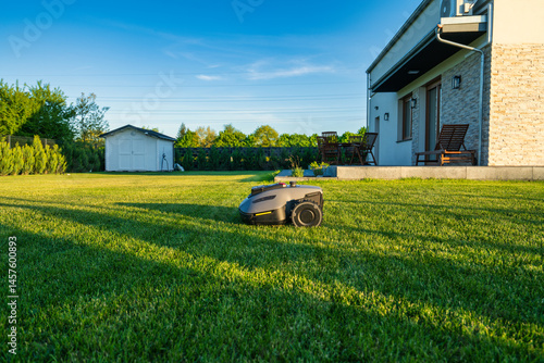 Obraz na płótnie Perfectly cut lawn by robotic lawn mower w salonie