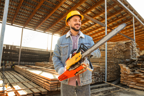 Male carpenter in hardhat w...
