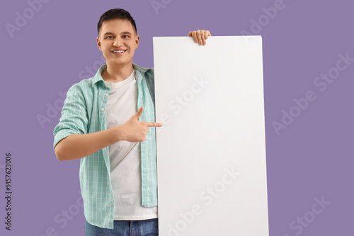 Handsome young man pointing...
