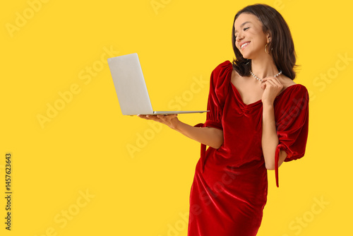 Beautiful woman with laptop...