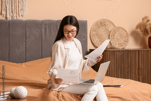 Beautiful young woman worki...