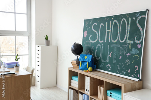 Shelf with backpack, books,...