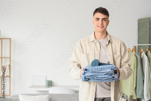 Young man with steamer and ...