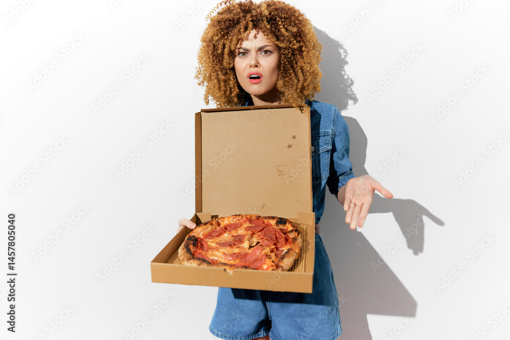 Upset woman with curly hair holding a pizza box expressing disappointment, showcasing a surprise reaction against a white background