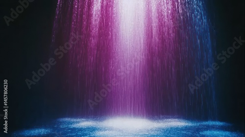 Vibrant cascade of light illuminates a surreal and captivating water feature
