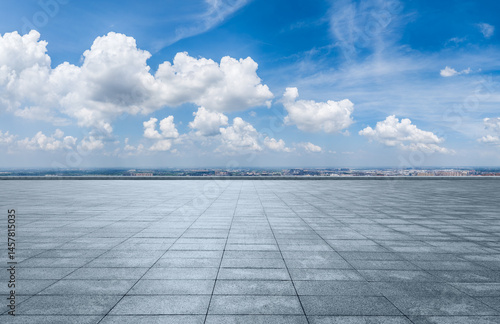 Fototapeta Naklejka Na Ścianę i Meble -  Empty square floor and city skyline with beautiful sky clouds on a sunny day