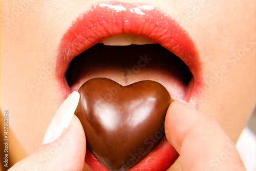 Heart Chocolate in Mouth with Red Lipstick