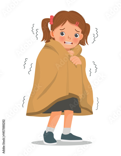 Little girl trembling and shivering feeling cold covered with blanket
