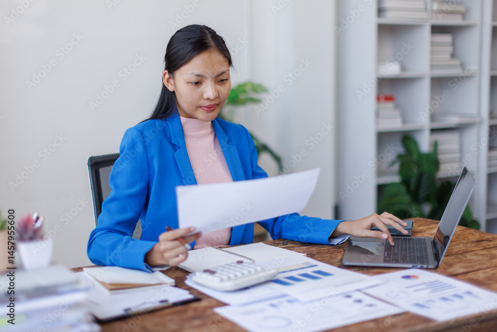 Young business asian woman typing on laptop holding papers preparing report analyzing work results, female executive doing paperwork at workplace using computer for data analysis
Young business asian woman typing on laptop holding papers preparing report analyzing work results, female executive doing paperwork at workplace using computer for data analysis