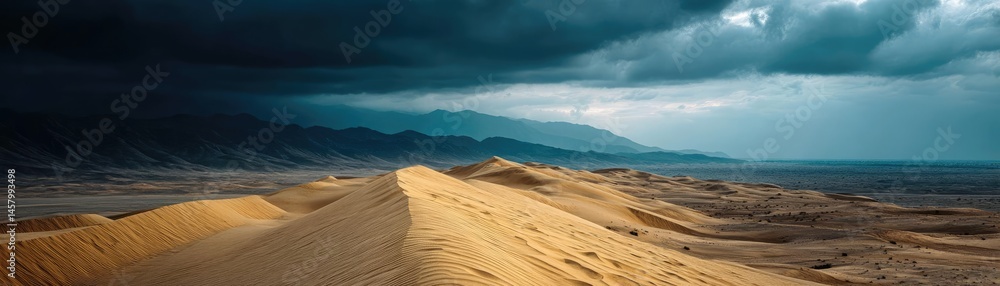 Fototapeta premium Panorama sand storm under dark cloudy sky with dust wave concept. Stunning view of desert dunes under a dramatic stormy sky.