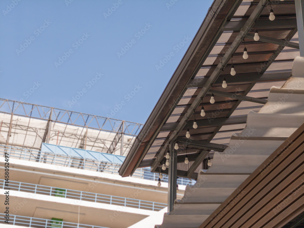 Fototapeta premium Low angle view, roof corner of shop food with gutters. blurred bg