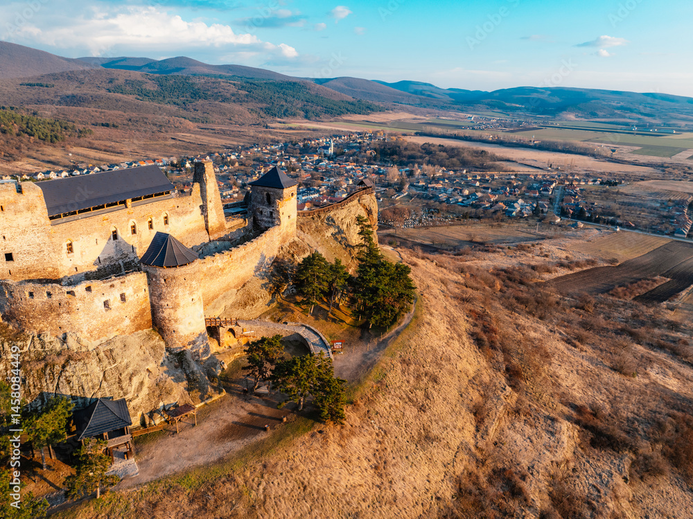 Fototapeta premium Watchtower of Boldogkő or Boldogko fortress with Boldogkővárallja village near tokaj region in Hungary