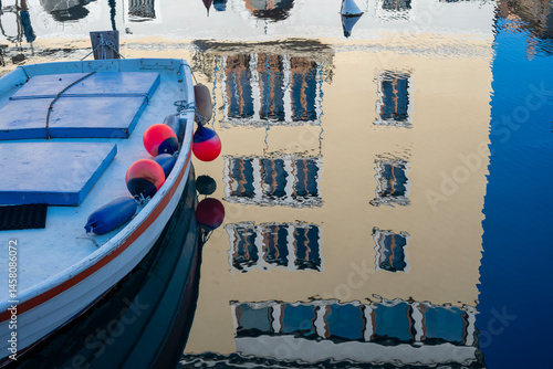 boat with building reflection