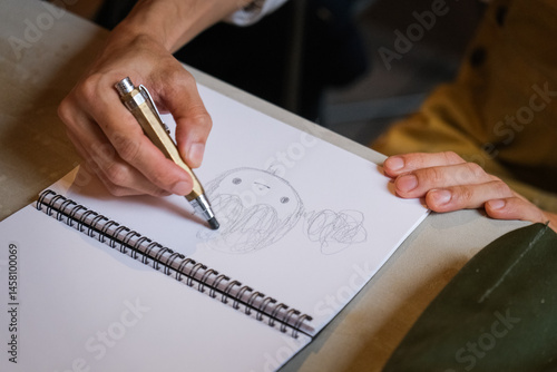 Close up of hand writing on paper