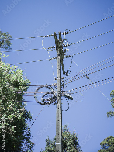 High voltage power lines on blue sky