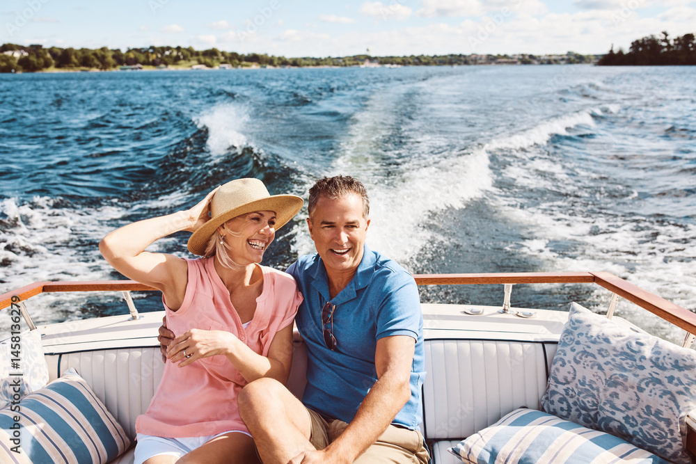 Boat, excitement and travel with mature couple at sea together for holiday, getaway or vacation for anniversary. Cruise, smile or yacht with man and woman on water for bonding, romance or voyage