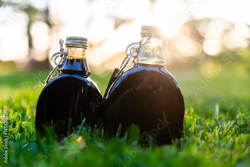 Bottles Of Maple Syrup In Natural Setting
