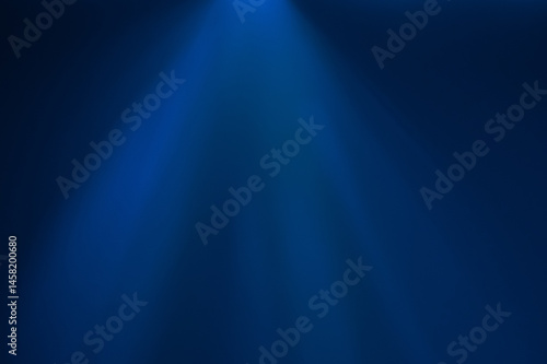 A beam of blue light cutting through the dark background